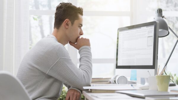 College student using computer at home