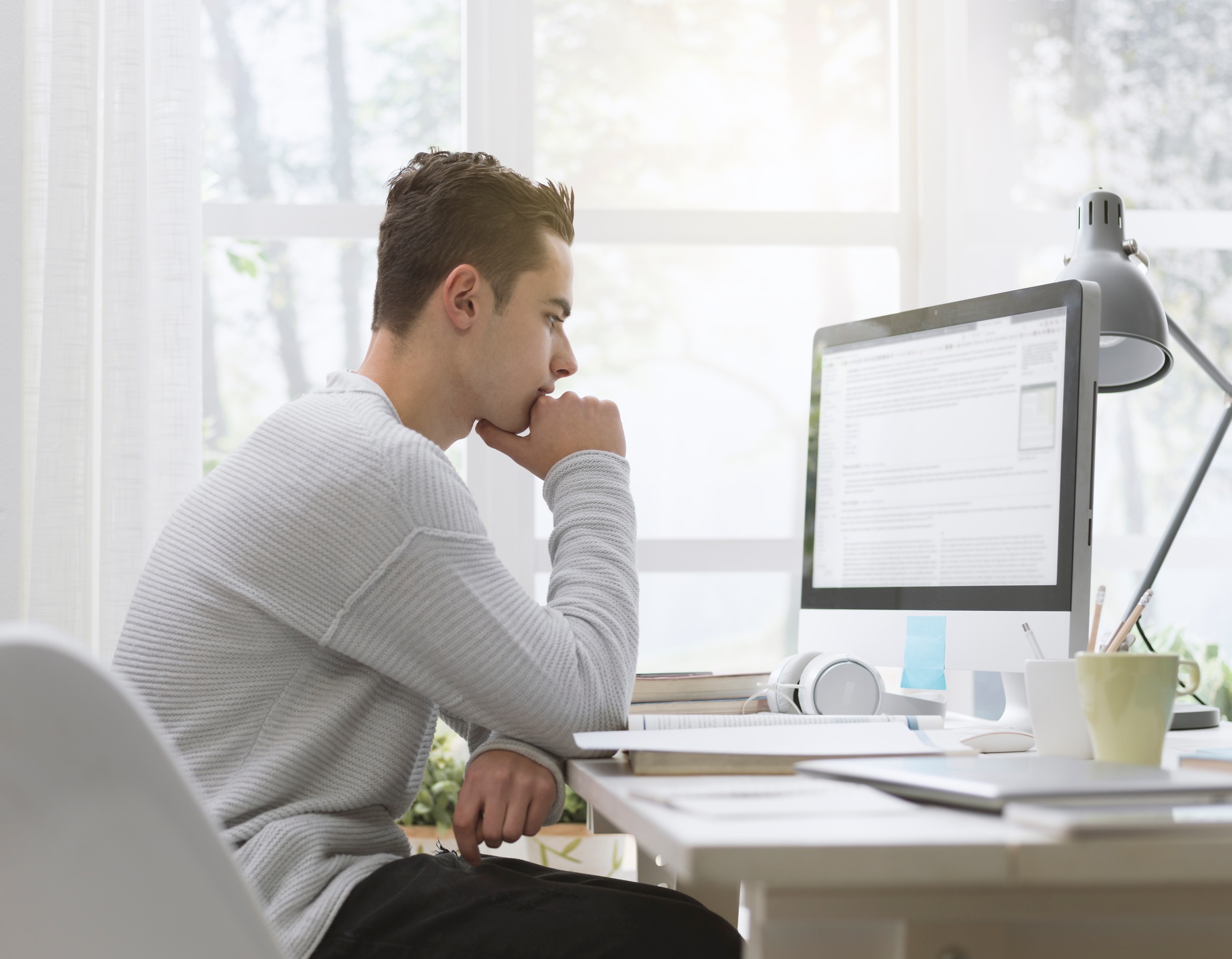 College student using computer at home